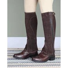 Models legs wearing a brown pair of Elico Amara Childrens Half Chaps over boots