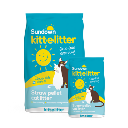 Two blue bags of Sundown Kitt-E-Litter with yellow lettering and an image of two cats.