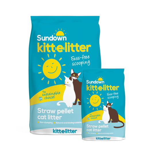 Two blue bags of Sundown Kitt-E-Litter with yellow lettering and an image of two cats.